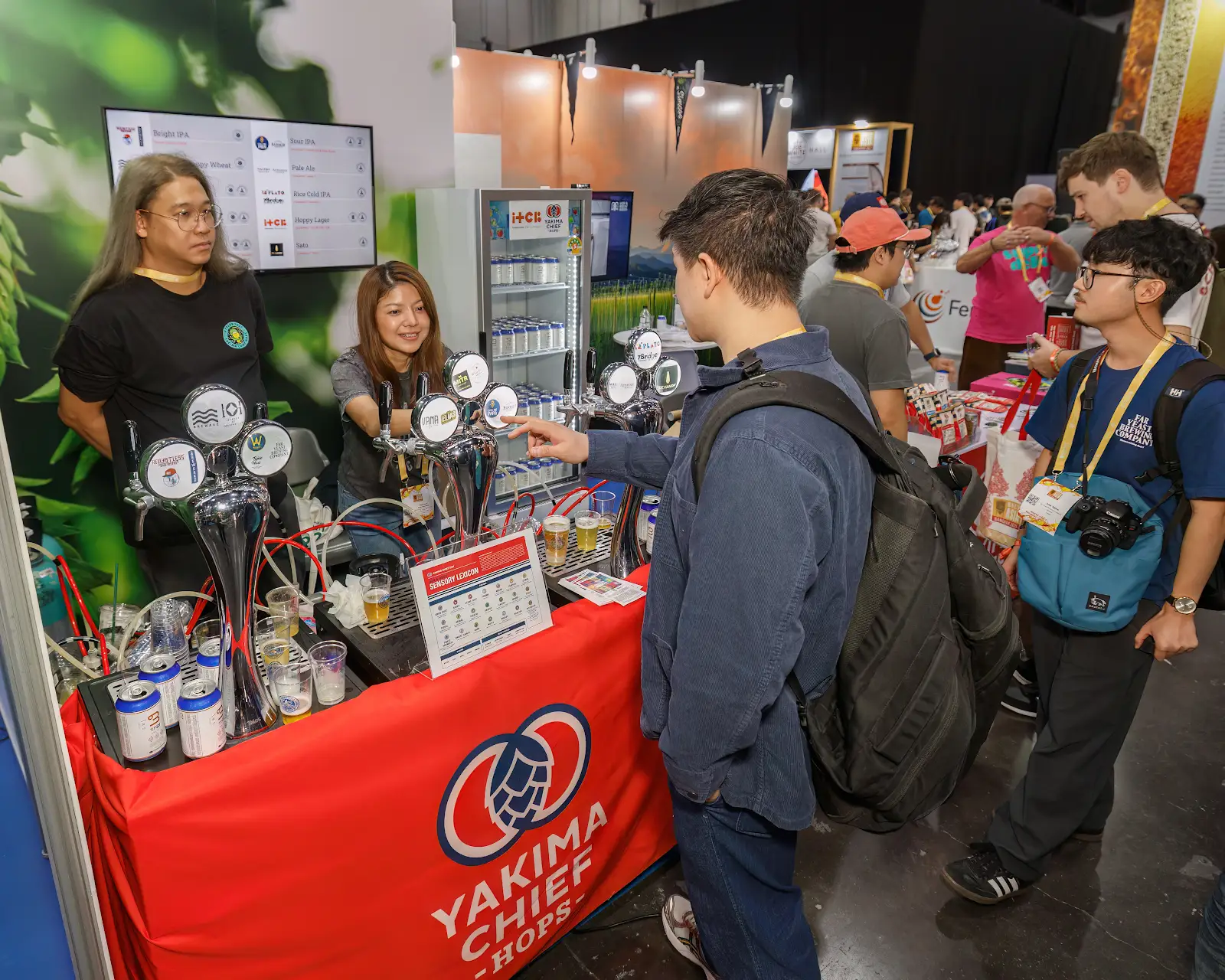 YCH tradeshow booth with visitors coming up and testing samples